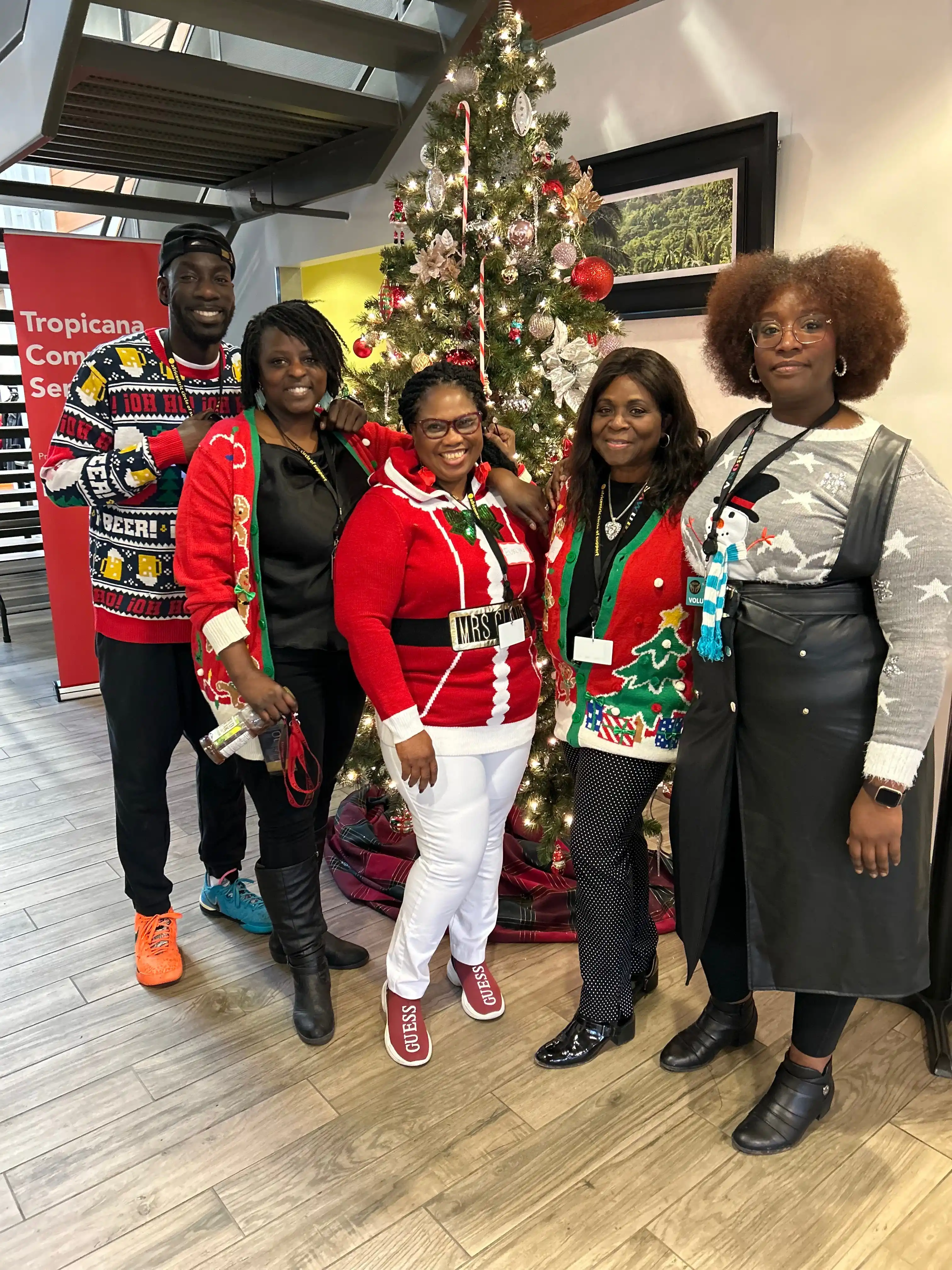 Coaches and staff of D3P Sports & Community standing together in a gym.
